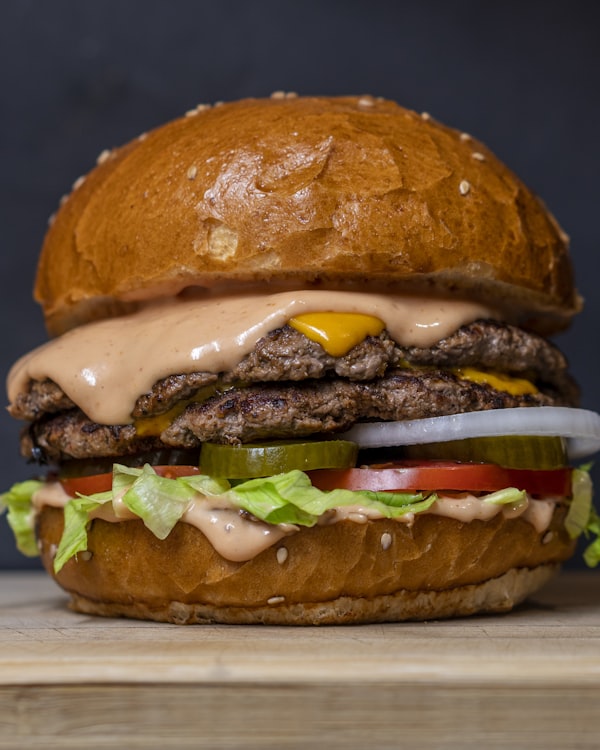 Double smash burger with melted cheese on a brioche bun